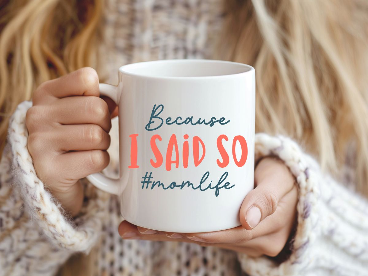 Person holding a mug with 'Because I Said So #momlife' text