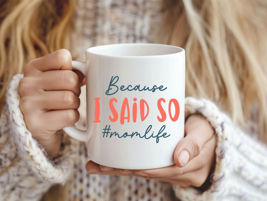 Person holding a mug with 'Because I Said So #momlife' text