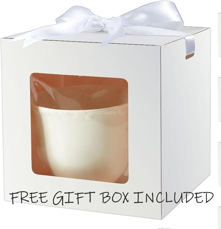 White gift box with a window, containing a white candle, and a white bow on top.