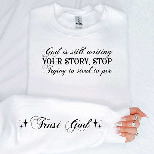 God Is Still Writing Motivational Sleeve Sweatshirt (up to 5X)